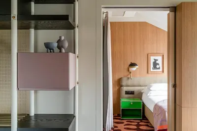 a bedroom with a bed and a bunk bed at PURO Kraków Stare Miasto in Kraków