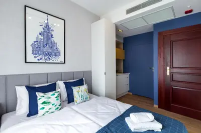 a bathroom with a shower and a toilet and a sink at Szewska 7 Apartments in Kraków