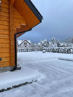 a log cabin in the snow with a yard at Miętusowa Chata pod Babią in Zawoja