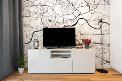 a living room with a tv on a white cabinet at NOVUM Apartment with Parking in Kraków