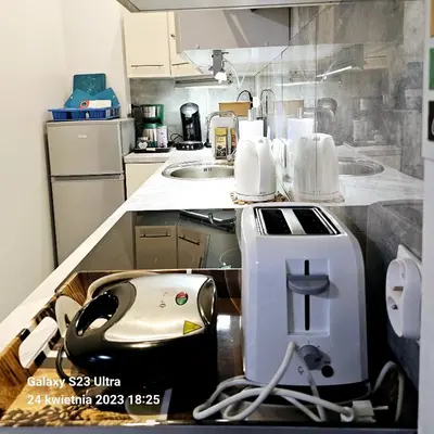 a kitchen with a appliance sitting on a counter at GAJ Apartment - Air condition, free parking in Kraków
