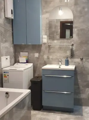 a bathroom with a sink and a toilet and a tub at GAJ Apartment - Air condition, free parking in Kraków