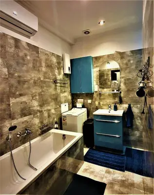 a bathroom with a tub and a sink at GAJ Apartment - Air condition, free parking in Kraków