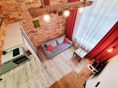 an overhead view of a living room with a couch at LOFT-to-be Apartment in Kraków