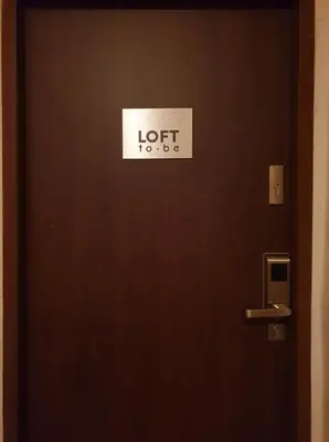 a door with a sign on it that reads idiotlords at LOFT-to-be Apartment in Kraków