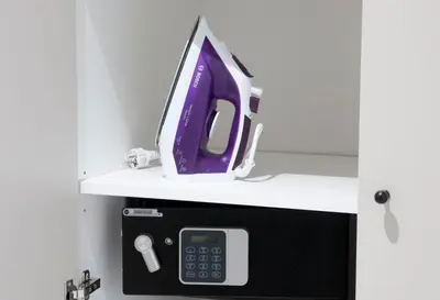 a computer monitor is on top of a microwave at NEARTOpl Rakowicka apartments Parking in Kraków