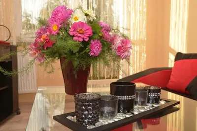 a vase with a bouquet of flowers on a table at Apartament Skałka in Jaworzno