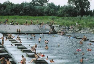 a large group of people swimming in a river at Pokoje nad Rabą in Myślenice