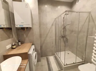 a bathroom with a shower and a toilet and a sink at Barska 21 by Homeprime in Kraków