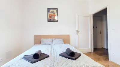 a bedroom with a bed with two towels on it at Barska 21 by Homeprime in Kraków