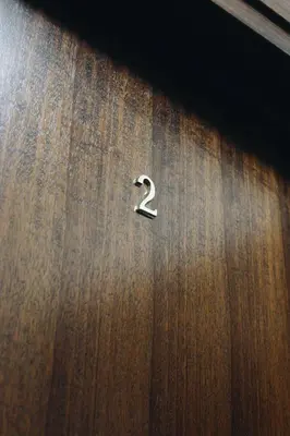 a wooden table with a number two on it at M2 Main Square Studio in Kraków