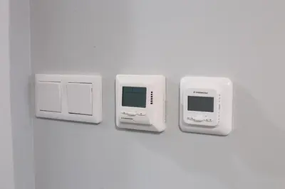 a white wall with two switches and a computer monitor at M4 Main Square Studio in Kraków