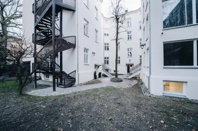 a building with a spiral staircase in a courtyard at M4 Main Square Studio in Kraków