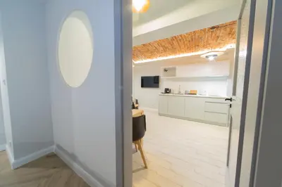 a view of a kitchen from the door of a room at M5 Main Square Stylish One Bedroom in Kraków