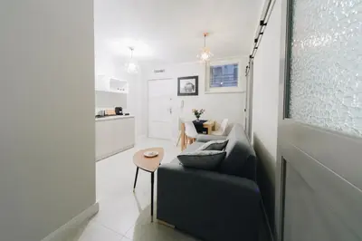 a living room with a couch and a table at M6 Main Square Stylish One Bedroom in Kraków