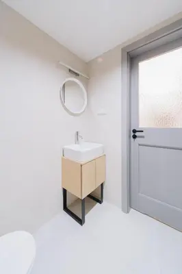 a bathroom with a sink and a mirror and a window at M6 Main Square Stylish One Bedroom in Kraków