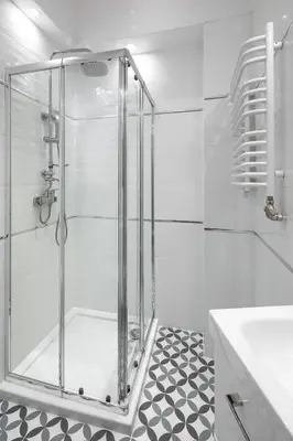a shower with a glass door in a bathroom at Native Apartments Starowiślna 33A Deluxe in Kraków