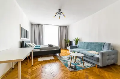 a living room with a couch and a table at Royal flats Old Town in Kraków
