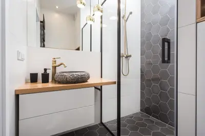 a bathroom with a shower and a sink at City of the Kings-Bacalar Apartment in Kraków
