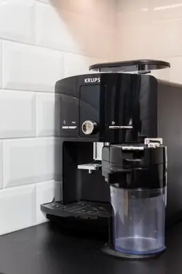 a coffee maker sitting on top of a counter at City of the Kings-Bacalar Apartment in Kraków