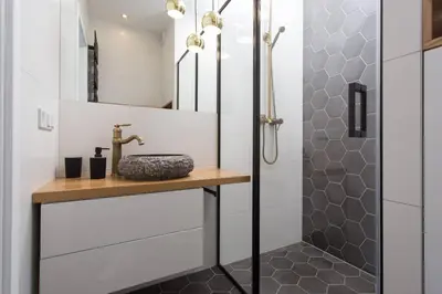 a bathroom with a sink and a shower at City of the Kings-Bacalar Apartment in Kraków