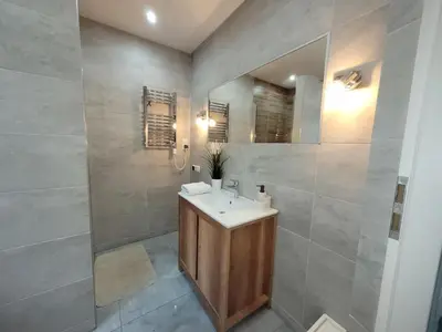 a bathroom with a sink and a mirror at Country House - apartamenty blisko Energylandii in Spytkowice