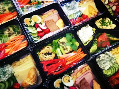 a bunch of plastic containers filled with different types of food at 3D Wawel Apartament in Kraków