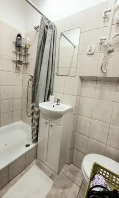a bathroom with a sink and a toilet and a shower at The apartment in strict city center. Self check-in in Kraków