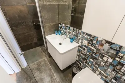 a bathroom with a sink and a toilet at Vintage Krasińskiego 7 Apartments in Kraków