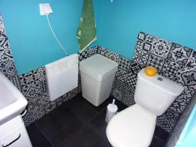 a small bathroom with a toilet and a sink at domek w centrum w Zawoi in Zawoja
