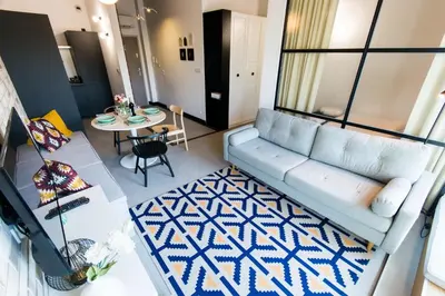 an aerial view of a living room with a couch and a table at Central balcony apartment - Window on Cracow in Kraków