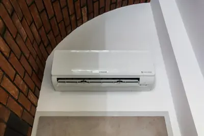a television sitting on a white counter in a room at Central balcony apartment - Window on Cracow in Kraków