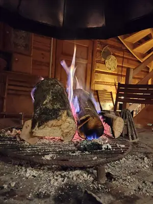 a fire pit with some rocks in it at Chałupa z widokiem w górach in Zawoja