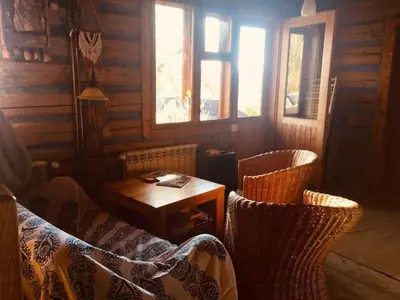 a room with a table and two chairs and a table and a tableablish at Chałupa z widokiem w górach in Zawoja