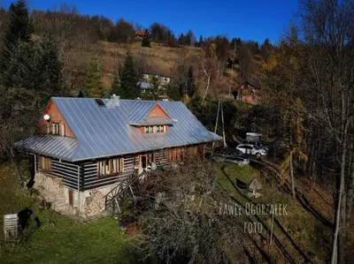 an overhead view of a house with a metal roof at Chałupa z widokiem w górach in Zawoja
