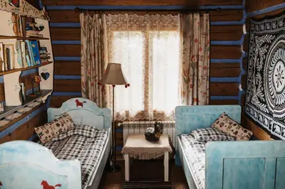 a log cabin with a deck in the snow at Chałupa z widokiem w górach in Zawoja