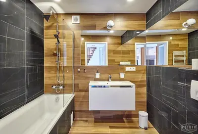 a bathroom with a sink and a shower at 3D WYGODA Apartamenty in Kraków
