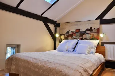 a bedroom with a large bed in a room at Tresor Barska Apartments 2.0 in Kraków
