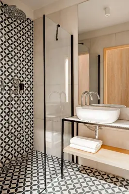 a bathroom with a sink and a shower at Hotel M29 in Kraków