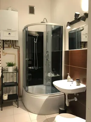 a bathroom with a shower and a sink at Apartament Galicja in Chrzanów