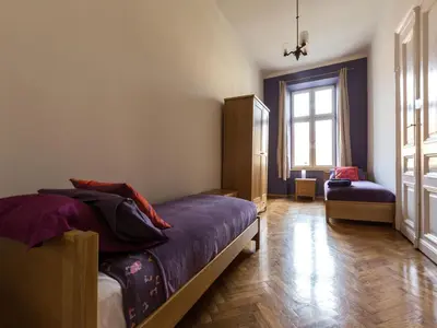 a bedroom with a bed and a window at Apartment in Krakow near Main Square in Kraków