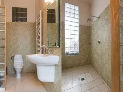 a bathroom with a sink and a toilet at Apartment in Krakow near Main Square in Kraków