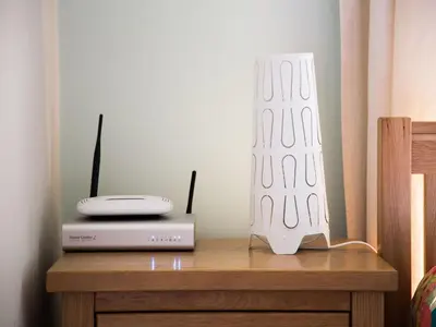 a table with a router and a white object on it at Apartment in Krakow near Main Square in Kraków