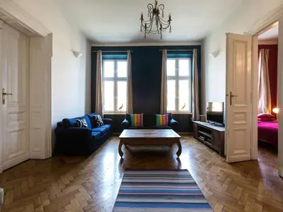 a living room with a couch and a table in it at Apartment in Krakow near Main Square in Kraków