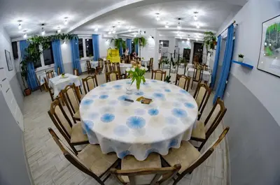 a dining room with a table and chairs at Zajazd u ELiZY in Czajowice