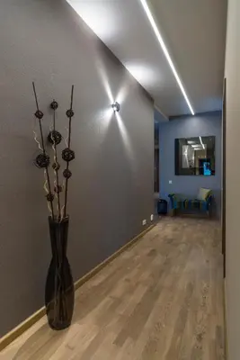 a living room with a vase with flowers in it at Natura Villa Spa in Węgrzce