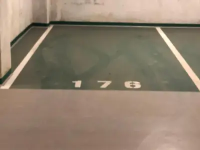 a tennis court with the number on the floor at Wislane Tarasy 2.0 by Atrium Apartments in Kraków