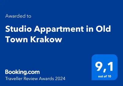 a blue sign that says tuition appointment in old town krakow with the words at Studio Appartment in Old Town Krakow in Kraków