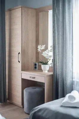 a bedroom with a desk and a bed with a window at Willa-Wita in Kalwaria Zebrzydowska