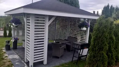 a white gazebo with a table in it at Willa-Wita in Kalwaria Zebrzydowska